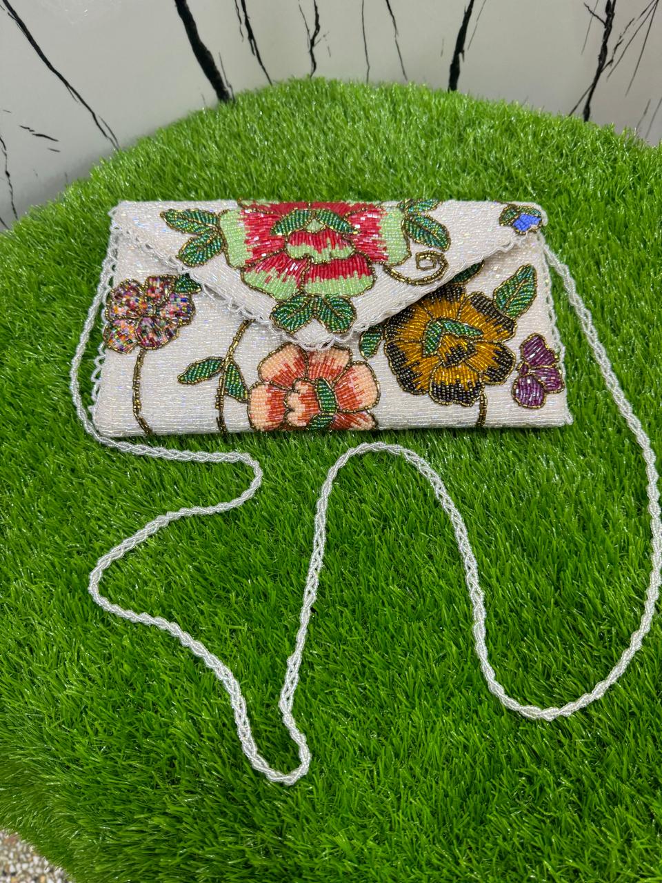 egant floral-inspired design beauty clutch