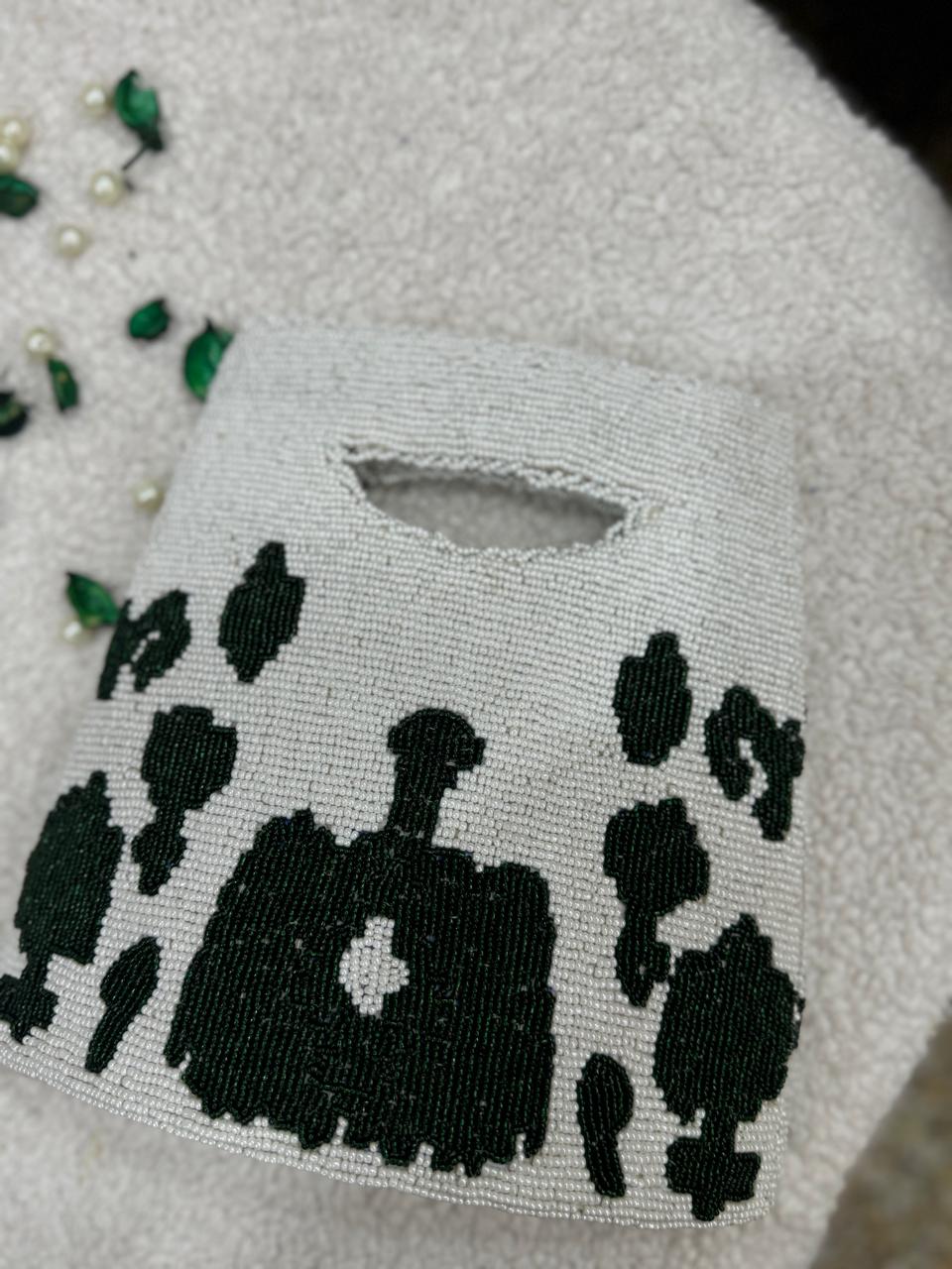 White & Green Handmade Beauty Bag with Elegant Detailing”