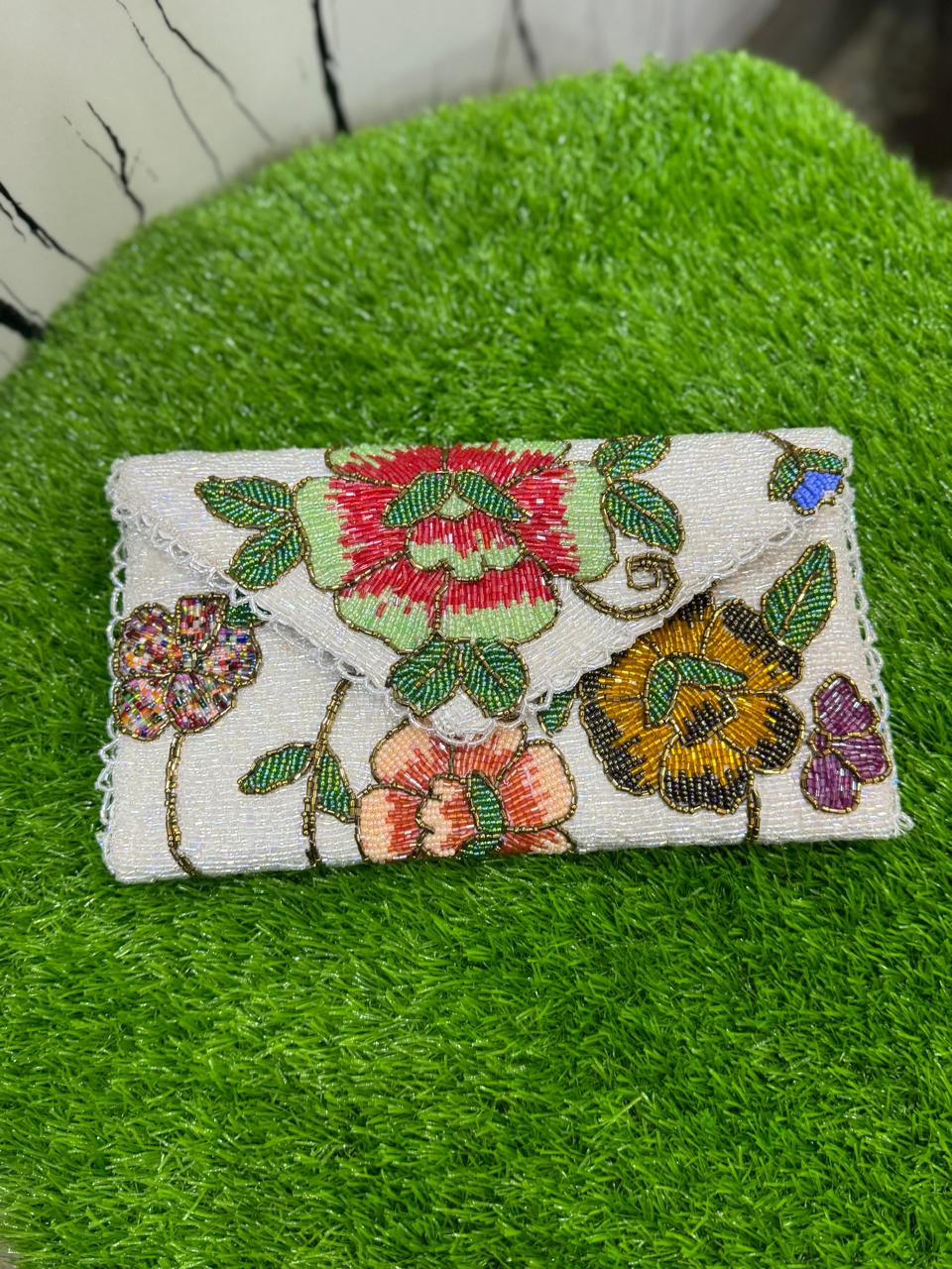 egant floral-inspired design beauty clutch