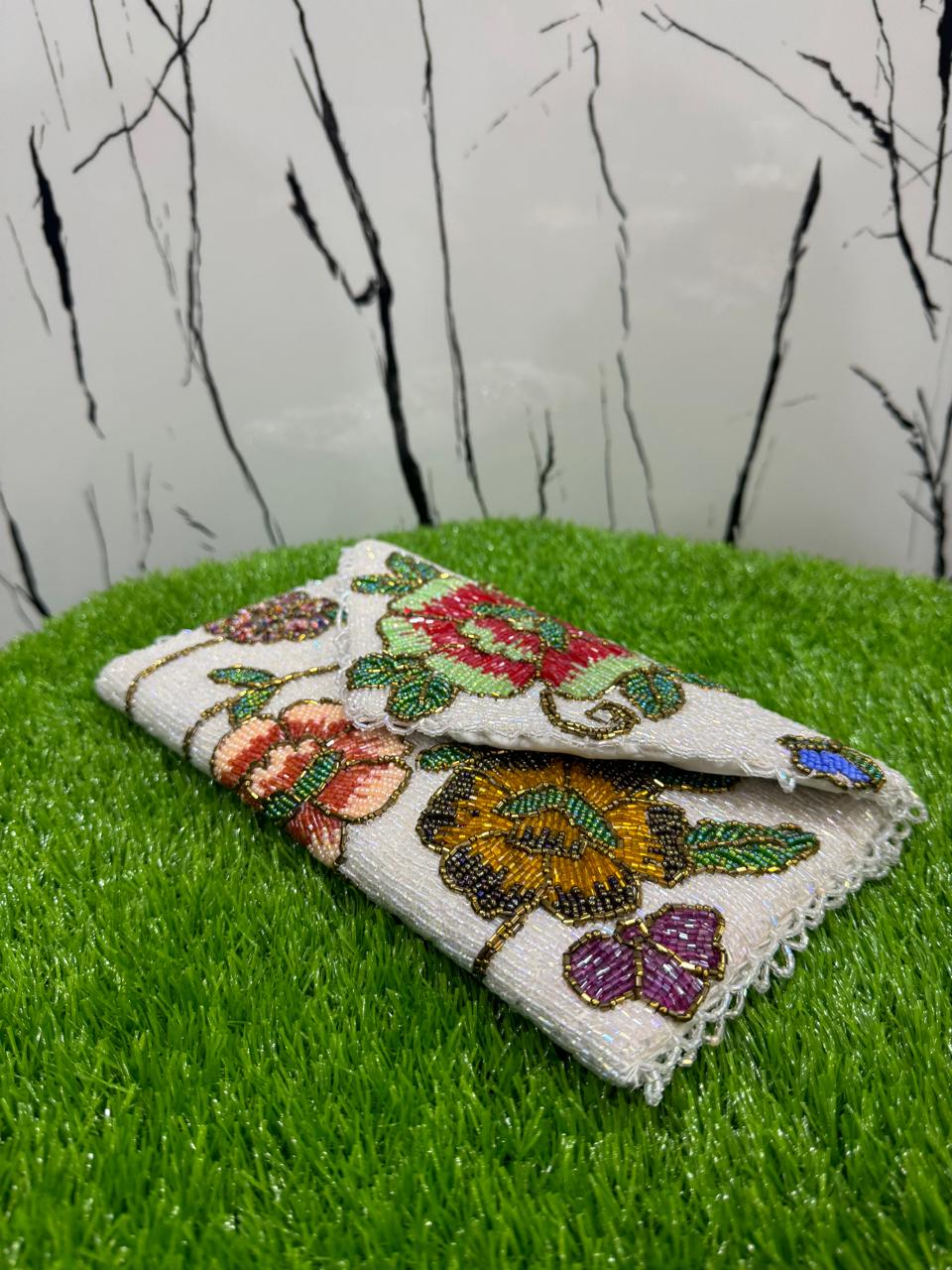 egant floral-inspired design beauty clutch