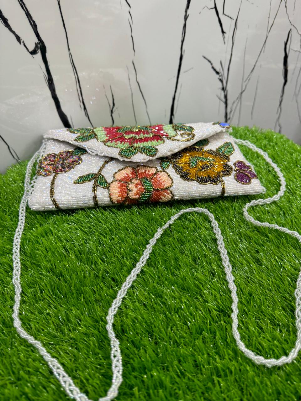 egant floral-inspired design beauty clutch